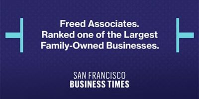 Alt text: A blue background featuring white text that reads "Freed Associates. Ranked Largest Family-Owned Business. SAN FRANCISCO BUSINESS TIMES."