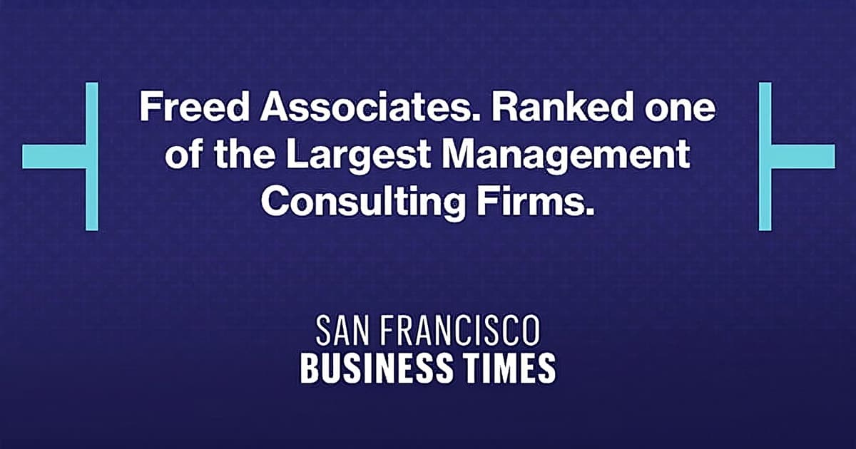 A blue background with white text displaying "Freed Associates. Ranked one of the Largest Management Consulting Firms. SAN FRANCISCO BUSINESS TIMES."