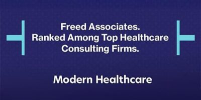 A blue background featuring white text that reads "Freed Associates. Ranked Among Top Healthcare Consulting Firms. Modern Healthcare."
